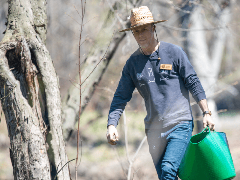 Intervale staff member in the woods at planting event