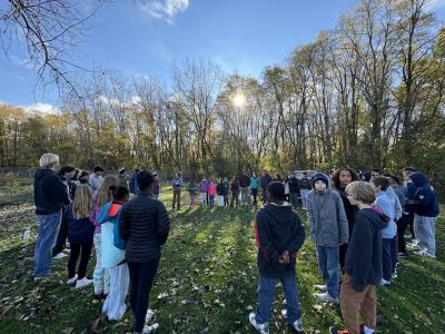 Students gather in circle for lesson